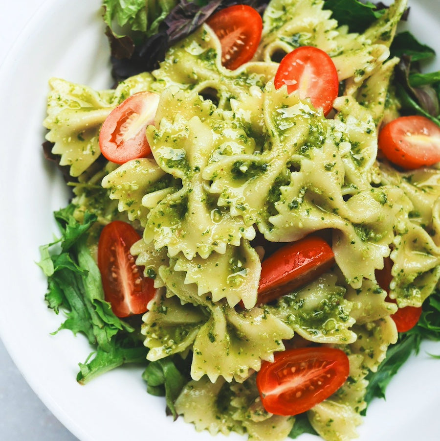 Taiga Farm and Seed Pasta Pesto Tomato Salad on Greens